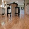 Red oak floor refinished from a dark brown stain to natural