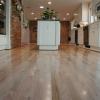 Red oak floor refinished from a dark brown stain to natural