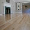 Red oak floor refinished from a dark brown stain to natural