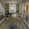 Historic home in Aiken with carpet removed, what is on all of the floor is glue that needed to be removed before a sand and refinish